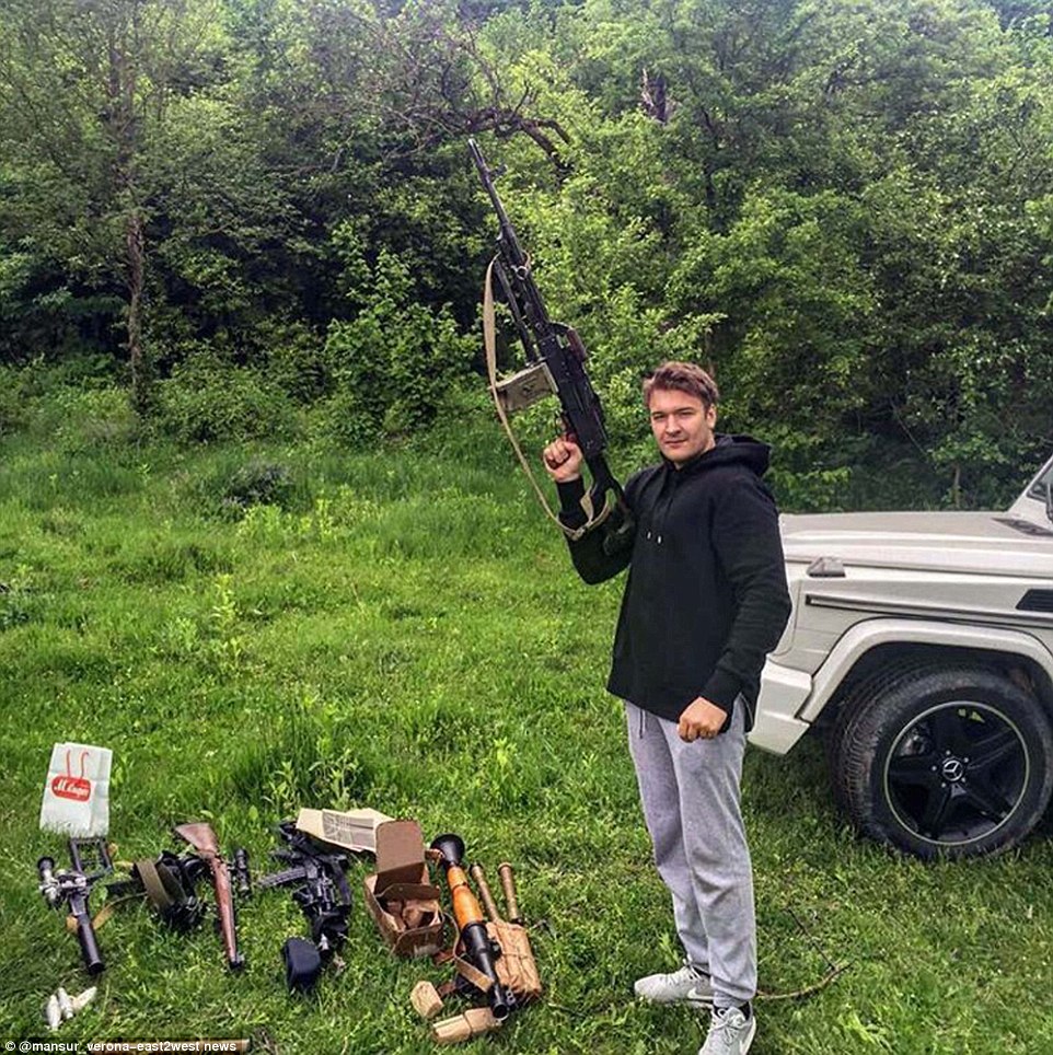 Personal arsenal: An Instagram user calling himself Mansur Verona poses with his personal arms cache and jokes about holidays in Chechnya, while also posting images of a Rolls Royce and a yacht 