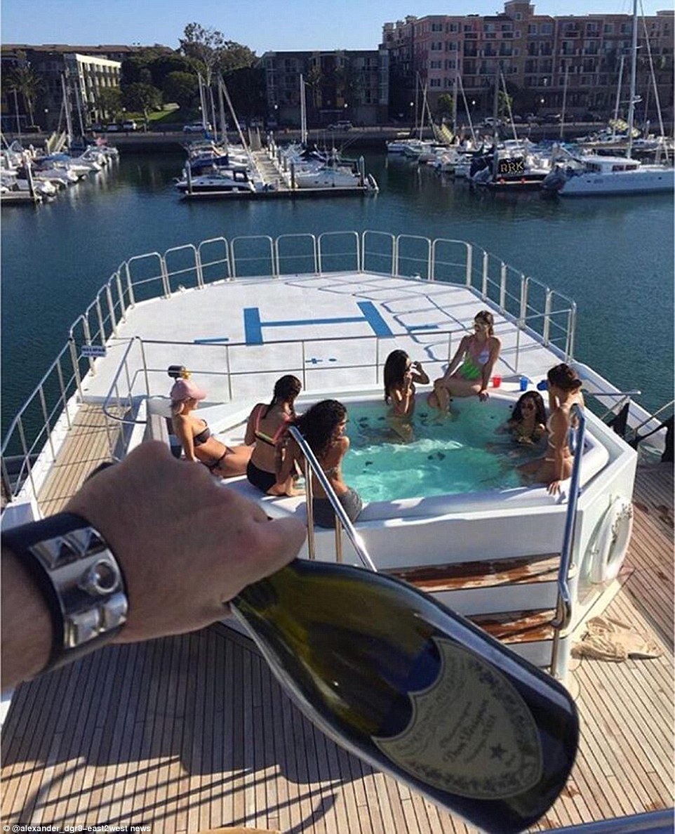 Tough life: Lounging in a Jacuzzi while sipping Dom Perignon from plastic cups, these Russian rich kids are well insulated from the fears about Brexit and dissent in Russia 