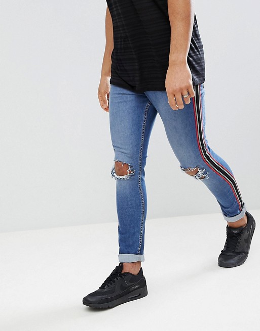 Выбеленные обтягивающие джинсы с потертостями и полосками