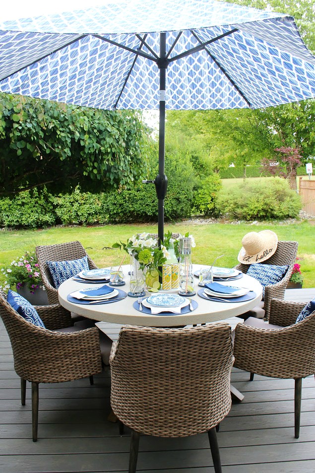 Beautiful simple summer outdoor tablescape in blue and yellow.